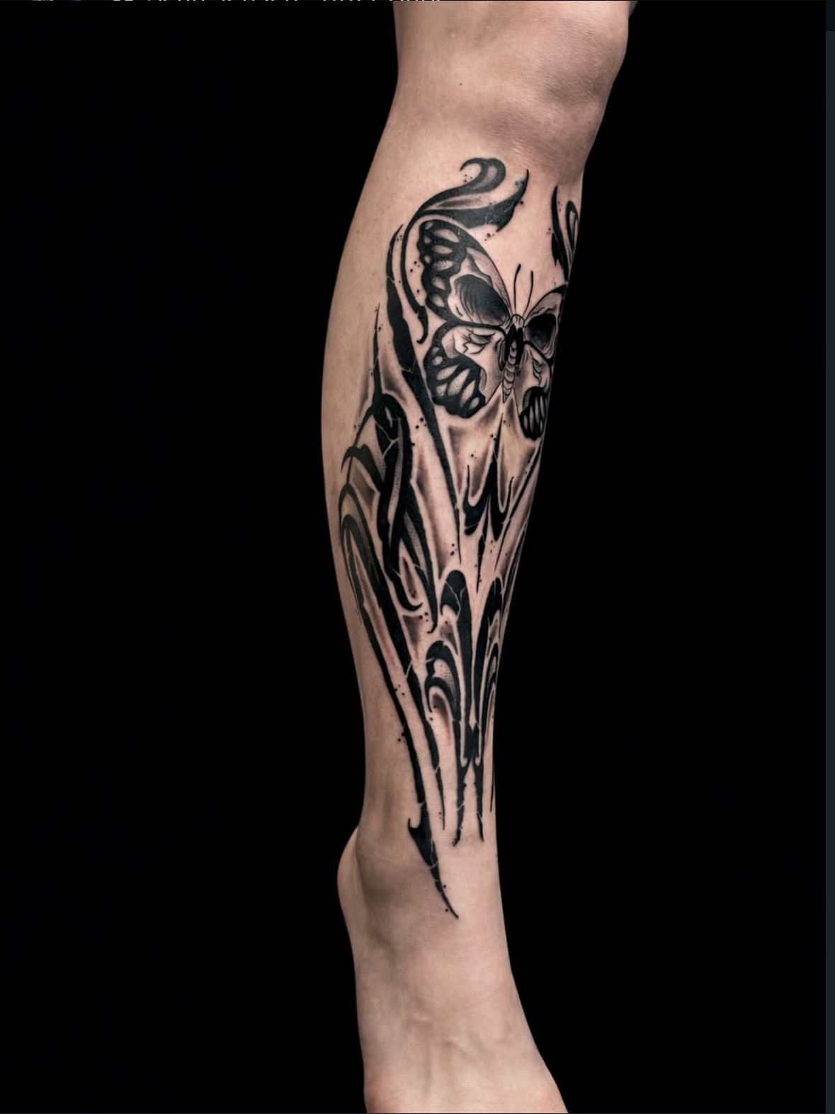 Butterfly ornamental Blackwork leg tattoo by Digo